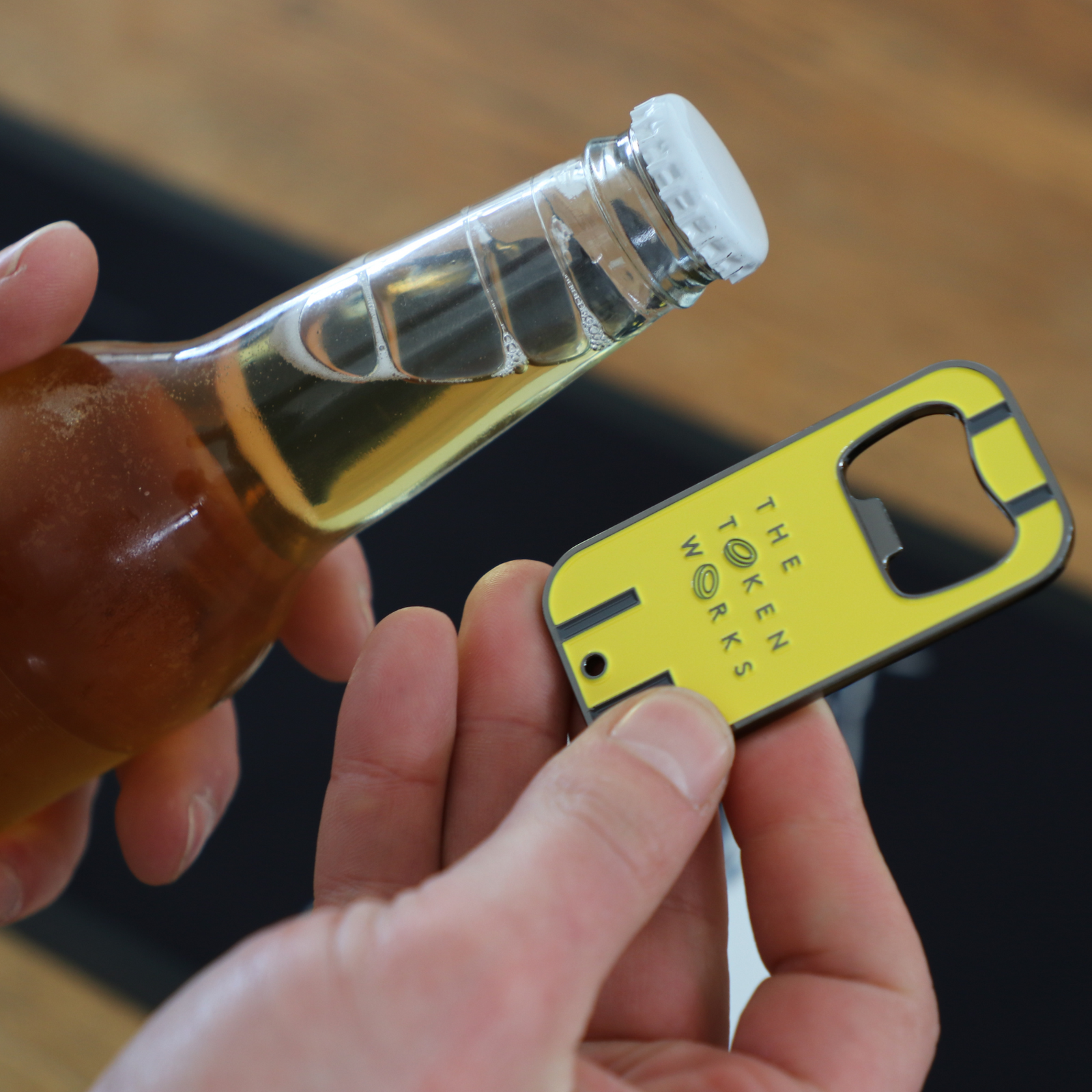 Custom bottle opener produced by The Token Works